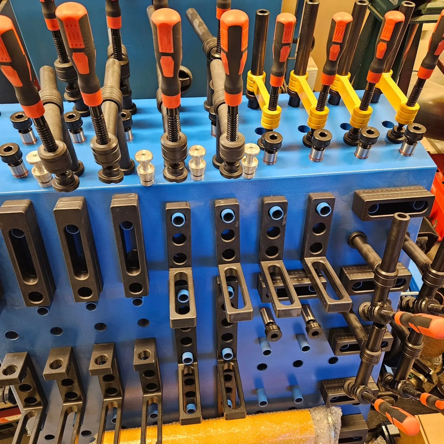 07-welding-table-clamps-and-fixtures-organized.webp